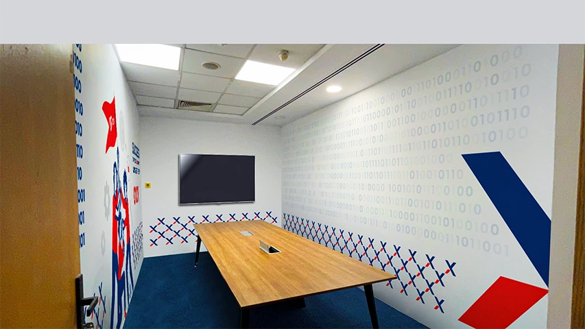 e-Tax meeting room with illustrated wall branding and geometric patterns